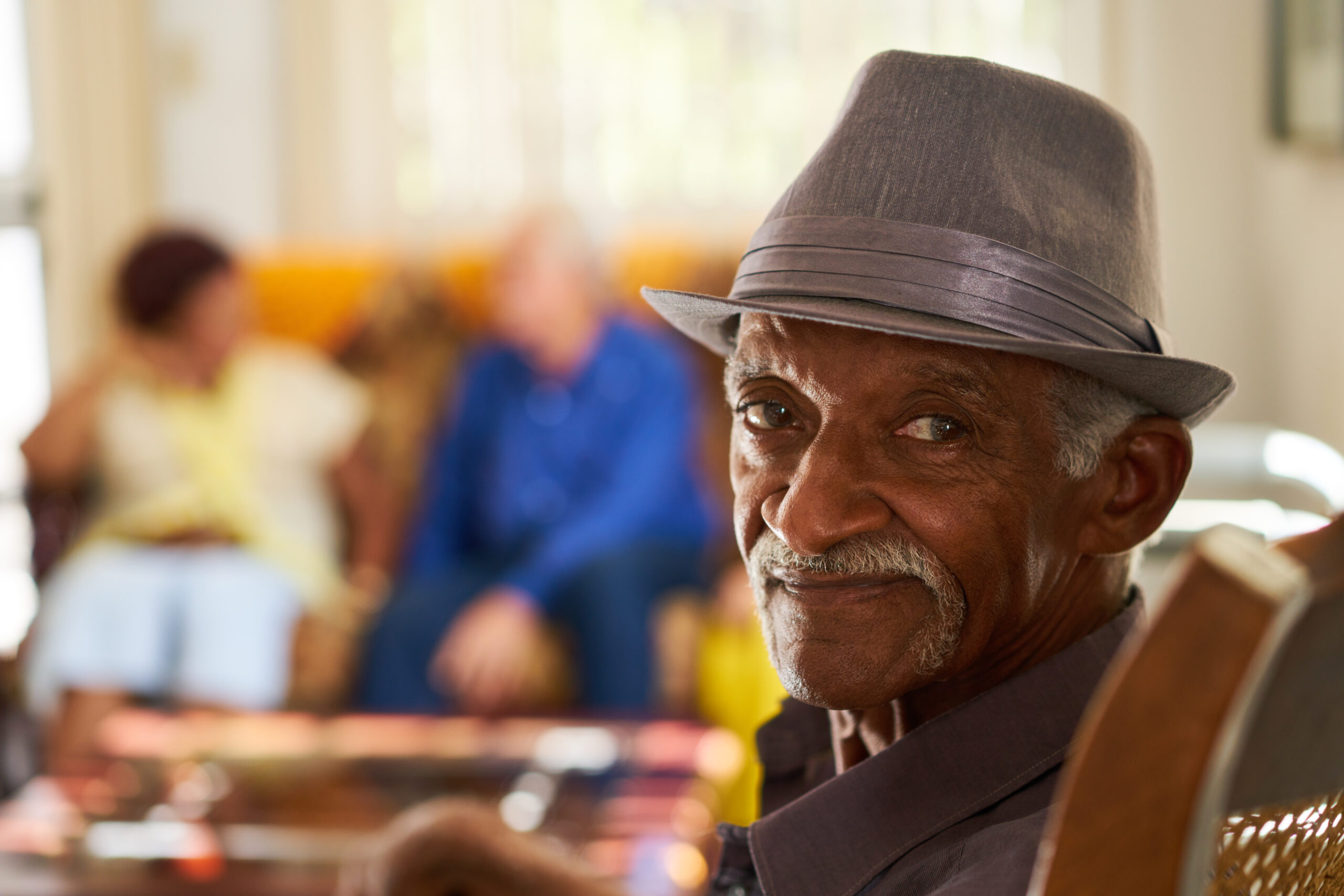 Portrait of elderly black man looking at camera