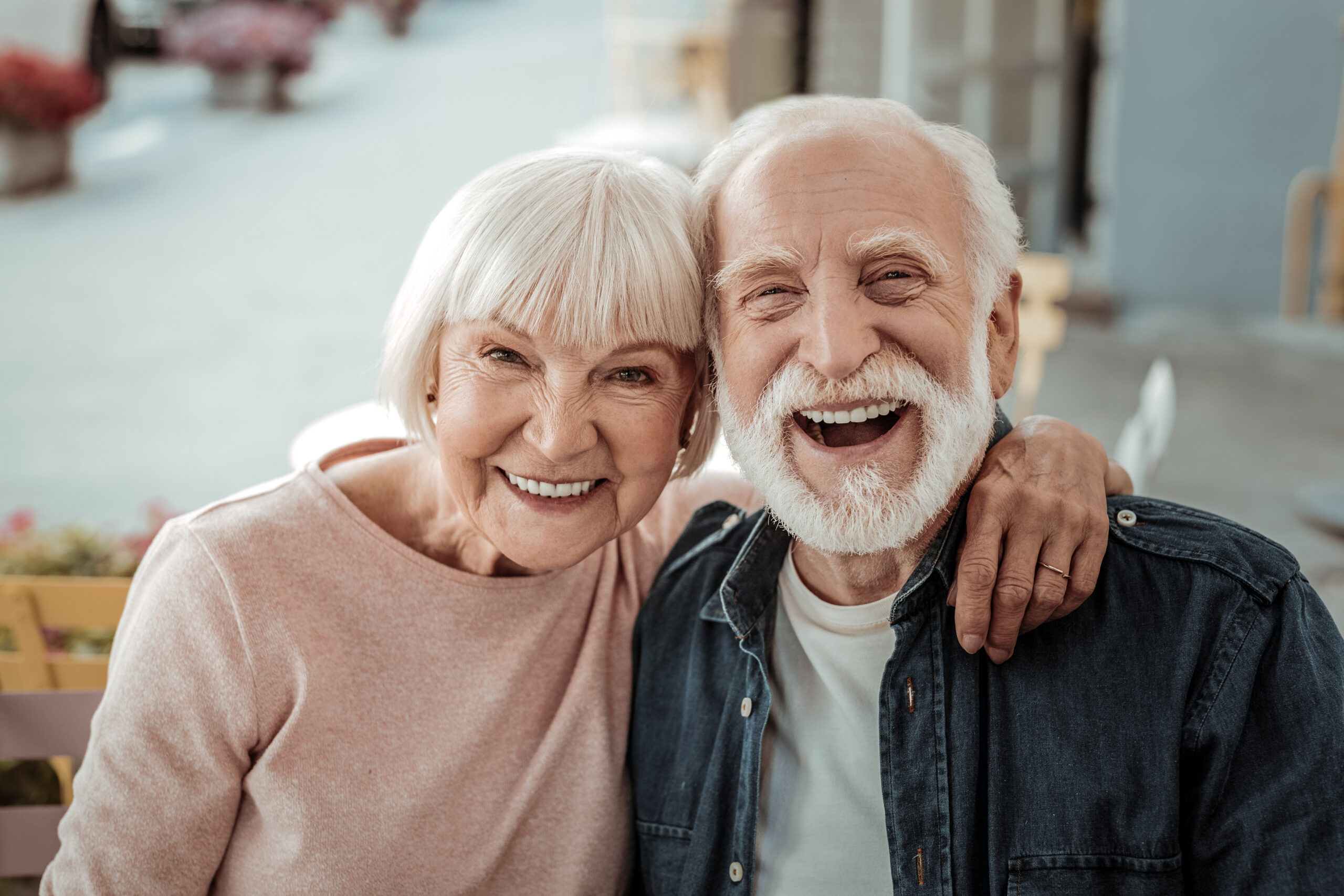 Joyful nice elderly couple smiling while being in a great mood