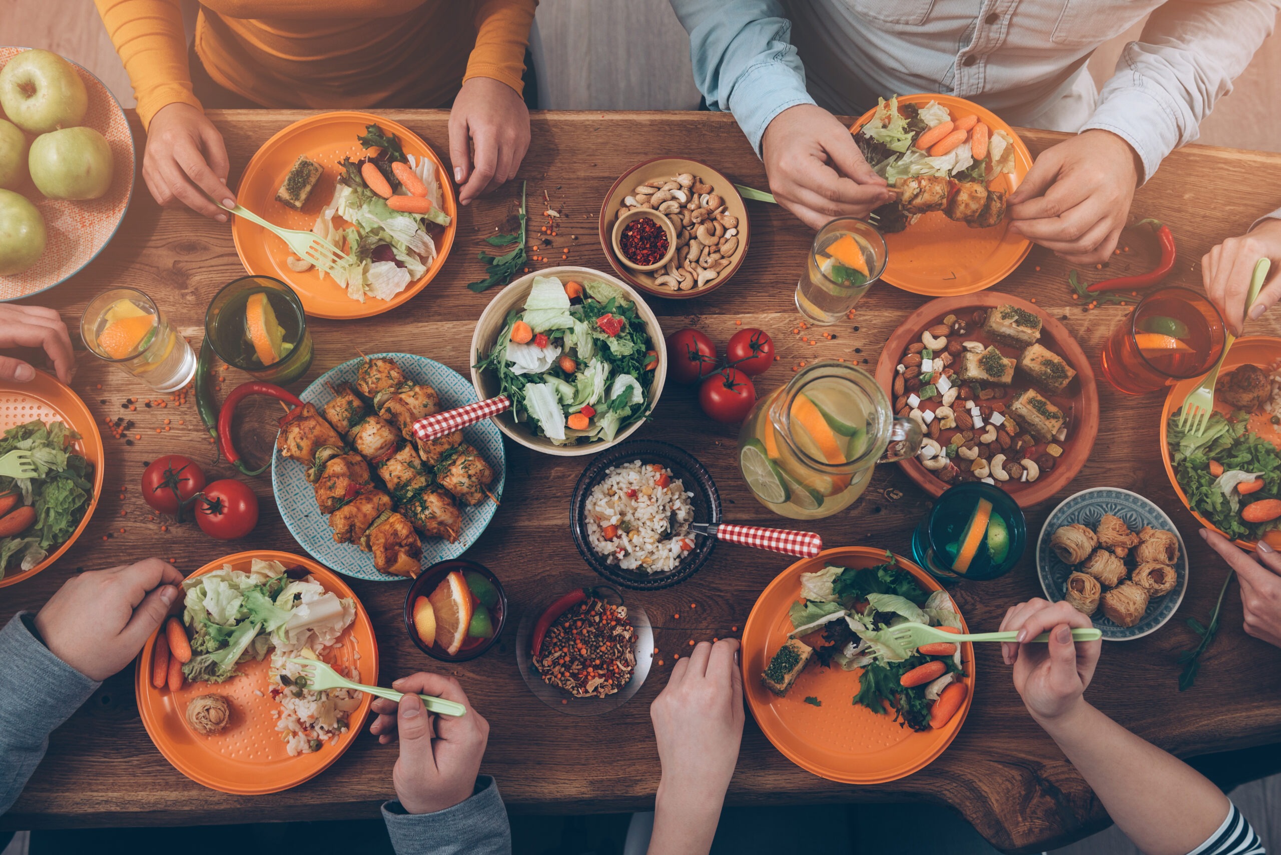 Top view of group of people having dinner