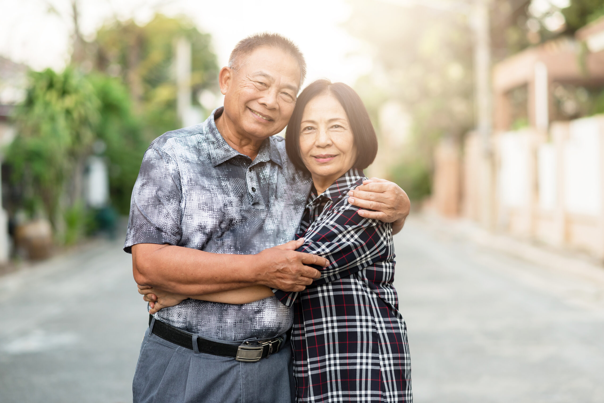 Happy senior Asian couple embracing each other